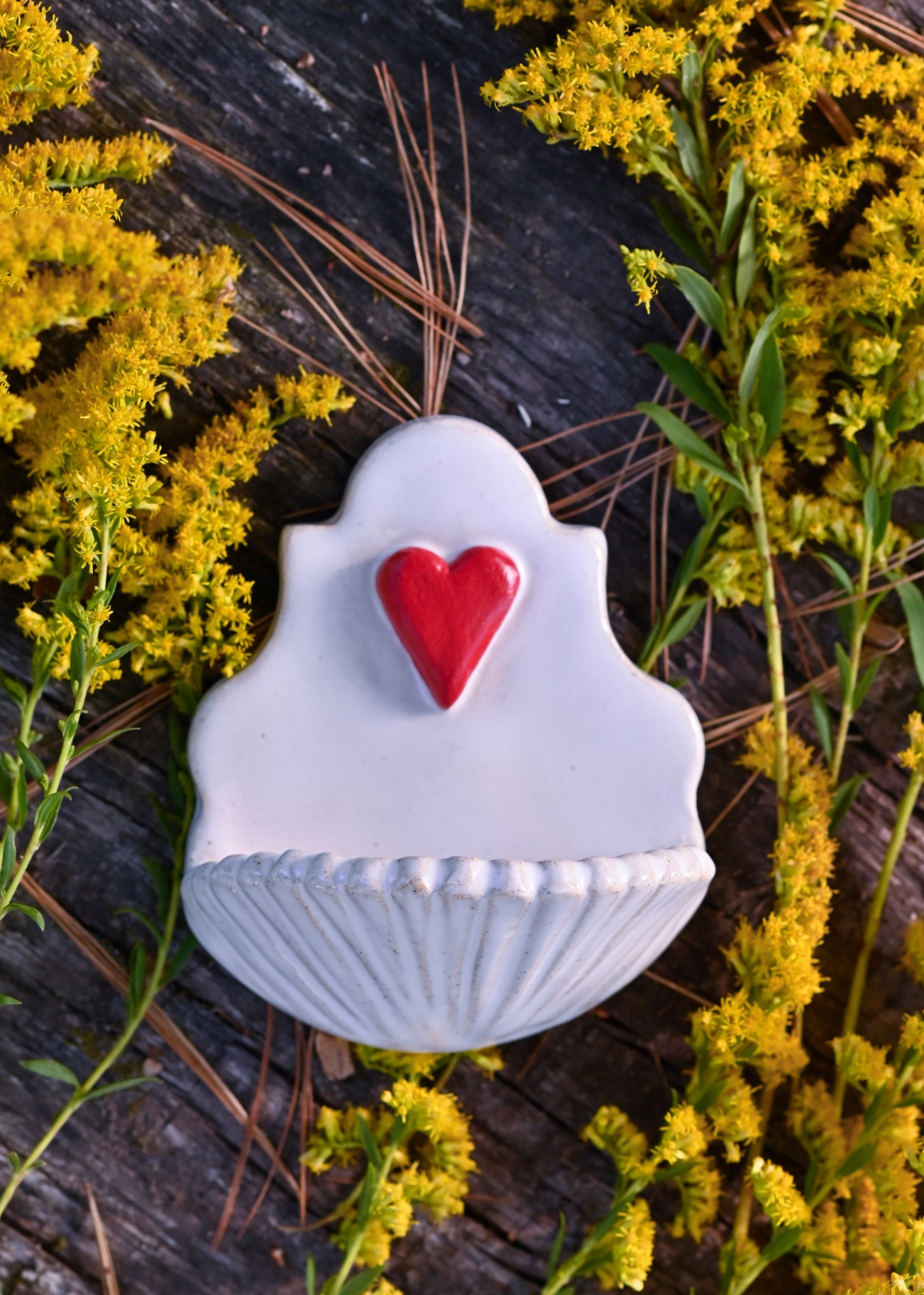 Monica's sacred heart stoup among wildflowers